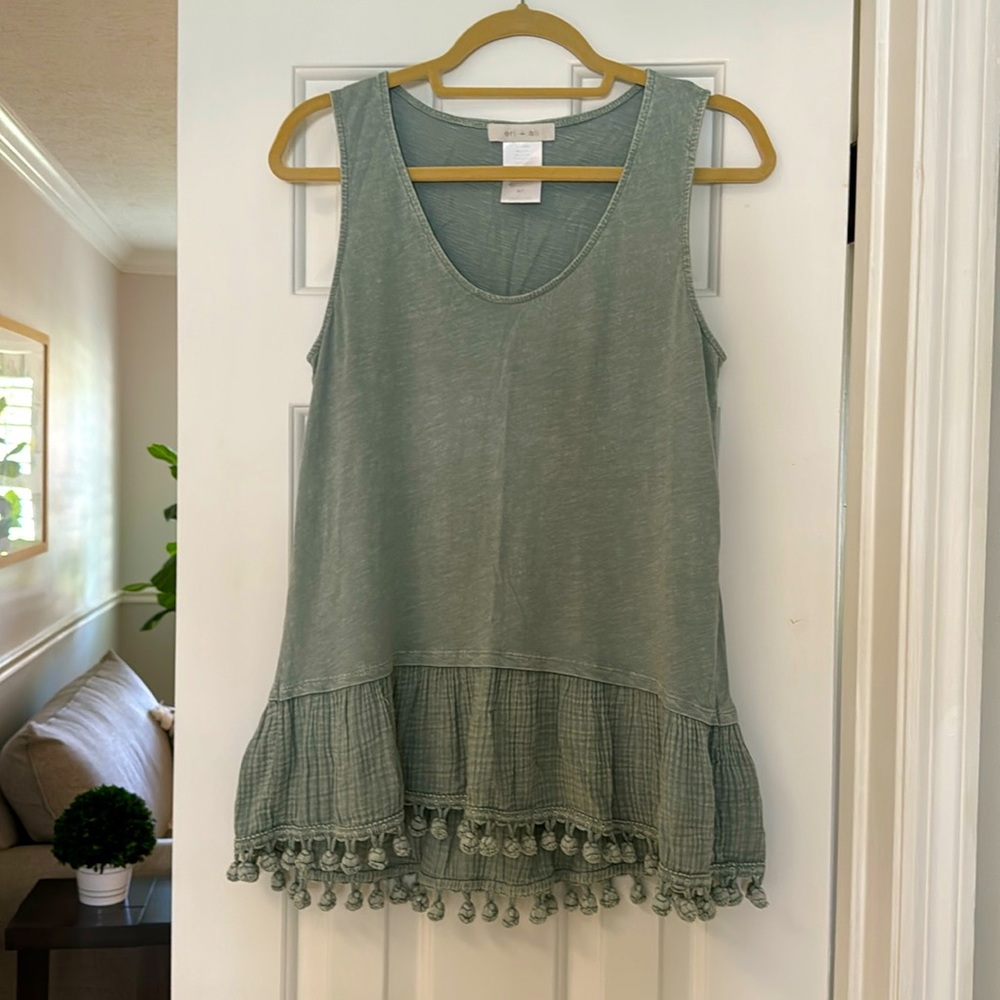 Pale green cotton sleeveless blouse size small with cute ball tassels